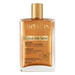 روغن مرطوب کننده و شاین صورت و بدن و مو بیوکسین مدل Gold On Skin حجم 100 میل